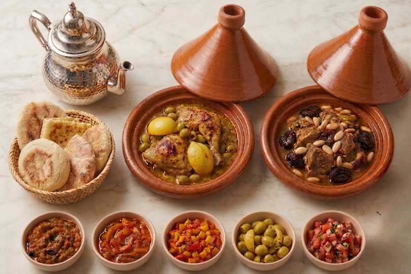Chefchaouen Moroccan family feast — tagines, Msamen and salads